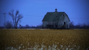Abandoned barn in a fallow corn field on a desolate winter’s evening at the blue hour. - Powered by Shutterstock - Get 15% off with code: PIKWIZARD15