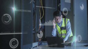 Animation of charts processing over asian male technician talking on smartphone in server room. Connection, data, processing, digital interface and global communication, digitally generated video. - Powered by Shutterstock - Get 15% off with code: PIKWIZARD15