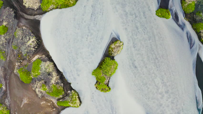 Aerial view of the torrents of water from the melting of the Fjallsjokull glacier, on its way to the sea, in southeast Iceland.
