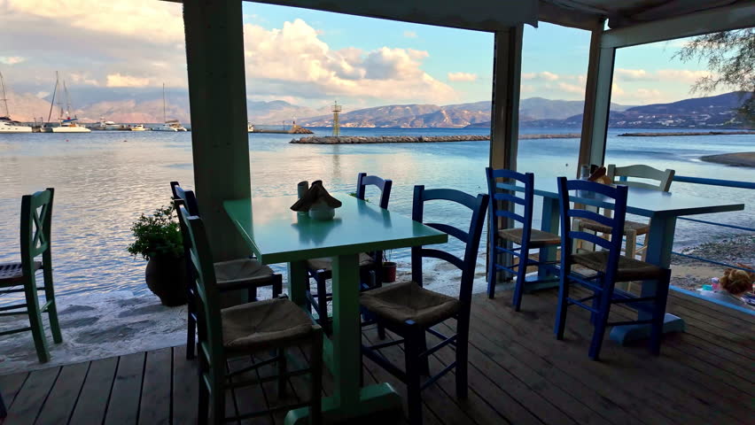 Fish tavern by the Agios Nikolaos lighthouse, Crete. Stunning sea views in Greece