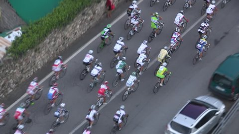 Pack of cyclists taking the lead at the head of a race
