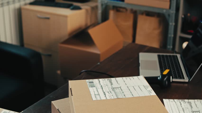 E-commerce storage shop, woman packing goods and clothes for second hand delivery market, dedicated Packaging and Shipping Workspace with Supplies and Technology for efficiency, online sales.