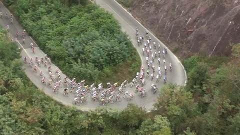 Large group of cyclists at the first stage of a bycicle race
