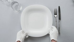 Elegant table setting with white tableware plates, cutlery, and glassware for a classy dining, fancy expensive restaurant dinner - Powered by Shutterstock - Get 15% off with code: PIKWIZARD15