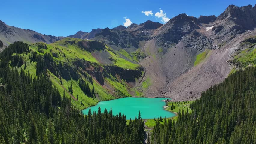 Sunny morning summer hiking trail Lower Blue Lake Mount Sneffels Wilderness Ridgway Telluride Colorado aerial drone San Juan Rocky Mountains Uncompahgre National Forest blue sky forward motion