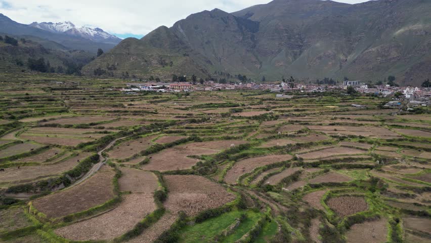 Aerial dolly shot: Pre-Inca terraced hillside at Cabanaconde in Peru