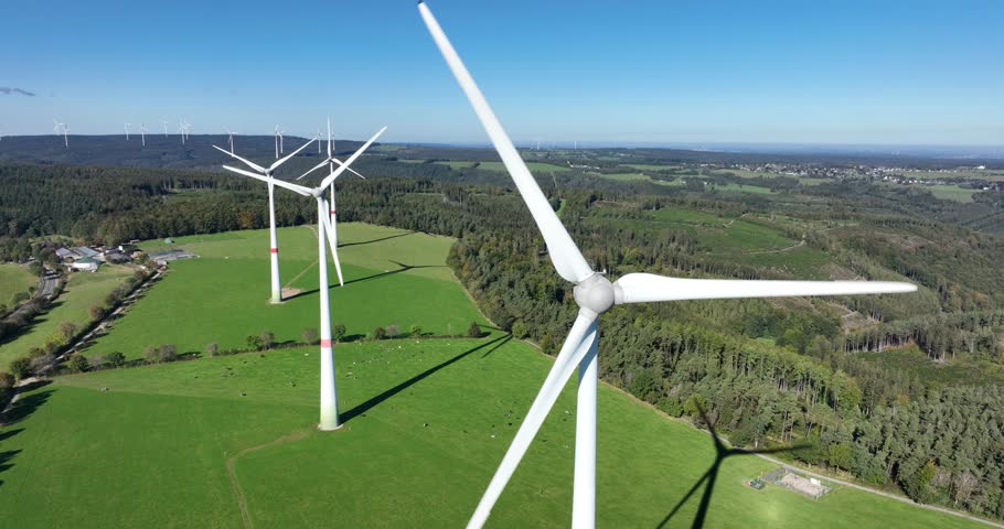 Wind turbine, generation of sustainable energy electricity, aerial drone video made in the hills and country side of Germany.