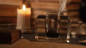 Writer man finished letter or manuscript. Gentleman hand dips feather quill pen in inkwell. Vintage cozy scene from 18th or 19th century. Correspondence concept. - Powered by Shutterstock - Get 15% off with code: PIKWIZARD15