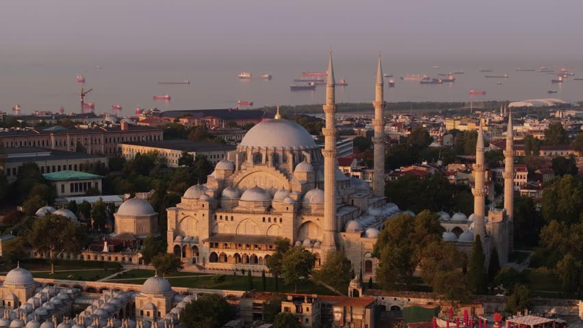 Beautiful Aerial View Above Suleymaniye Mosque at Sunrise, Oil Tanker Ships in Background