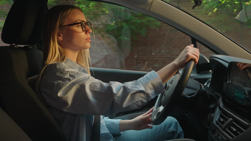 Caucasian woman driver handbrake seat belt leaving car new automobile transport businesswoman owner buyer travel luxury machine ride traffic customer road renting trip steering way driving girl female