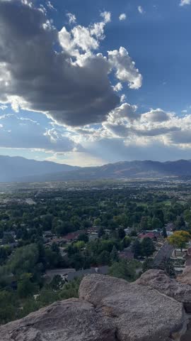 Video scenery of the view in Colorado of the rocky mountains, cloudy blue sky, trees and forest from the Grandview Overlook in Colorado Springs, CO.
