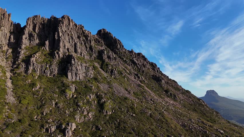 Cradle Mountain peak in Central Highlands region of Tasmania, Australia. Aerial drone orbiting