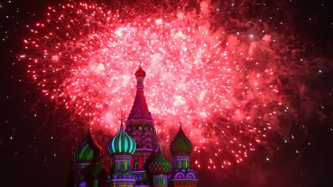 MOSCOW - AUG 31: Top of Saint Basil Church and sky illuminated by fireworks at Military Music Festival Spasskaya Tower, on Aug 31, 2011 in Moscow, Russia.