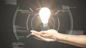 Animation of scope scanning and data processing over hand with lightbulb. Global technology, science and digital interface concept digitally generated video. - Powered by Shutterstock - Get 15% off with code: PIKWIZARD15