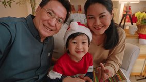 happiness asian family grandparent taking video phot selfie with grandson together in christmas eve thanksgiving celebrate family night with love and gathering multi generation relation in christmas  - Powered by Shutterstock - Get 15% off with code: PIKWIZARD15