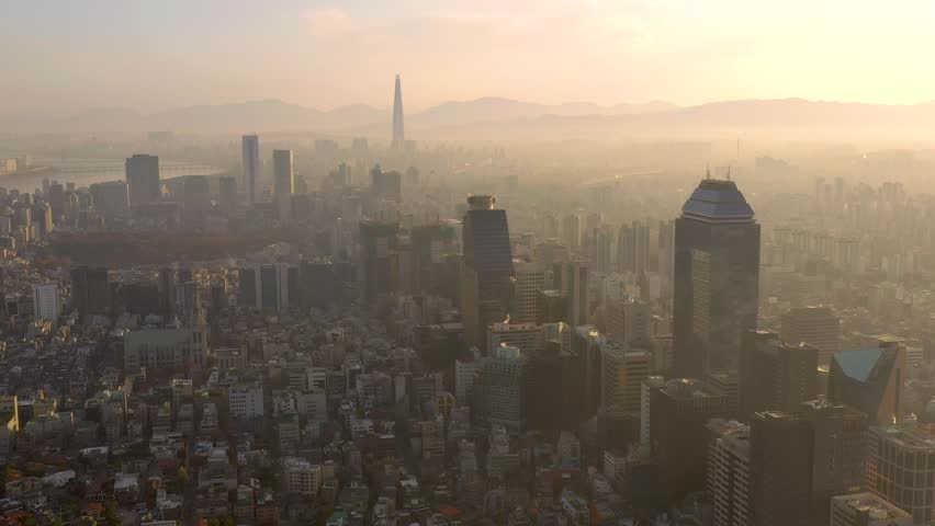 SEOUL, SOUTH KOREA - SEPTEMBER 9, 2024: Aerial view of the city skyline shrouded in mist at dawn with tall buildings