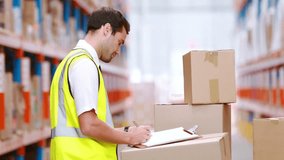 Animation of network of connections with icons over caucasian man working in warehouse. Global shipping, connections, computing and data processing concept digitally generated video. - Powered by Shutterstock - Get 15% off with code: PIKWIZARD15