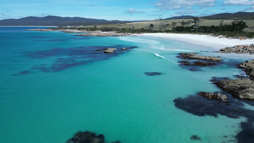 An aerial footage of the Gardens Lagoon Beach and the Bay of Fires Conservation Area on a sunny day on Tasmania