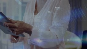 Animation of data processing over caucasian businesswoman using tablet. Global business, technology and digital interface concept digitally generated video. - Powered by Shutterstock - Get 15% off with code: PIKWIZARD15
