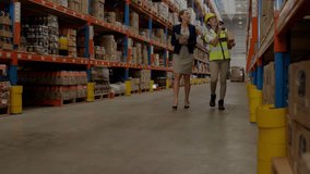 Animation of network of connections over caucasian female worker and supervisor in warehouse. Global delivery, technology and digital interface concept digitally generated video. - Powered by Shutterstock - Get 15% off with code: PIKWIZARD15