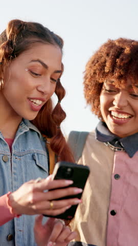 Phone, post and women in city together with smile, streetwear and checking social media meme. Smartphone, urban fashion and happy gen z girl friends on mobile app for connectivity, networking and fun