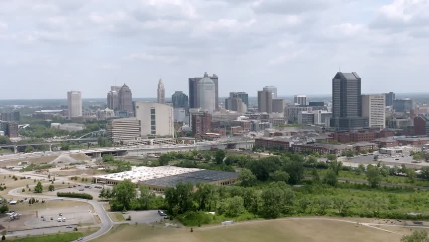 Parallax wide view of Columbus, Ohio skyline with drone video moving in a circle.