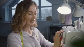 Smiling seamstress works diligently at her sewing machine in a workshop, skillfully sewing a piece of fabric with passion and dedication. The atmosphere reflects creativity and craftsmanship - Powered by Shutterstock - Get 15% off with code: PIKWIZARD15