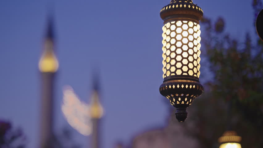 Close-up of Beautifully lit lamp in focus with a blurred background of Hagia Sophia mosque