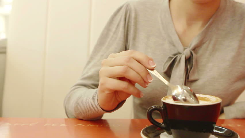 Young woman drink coffee alone