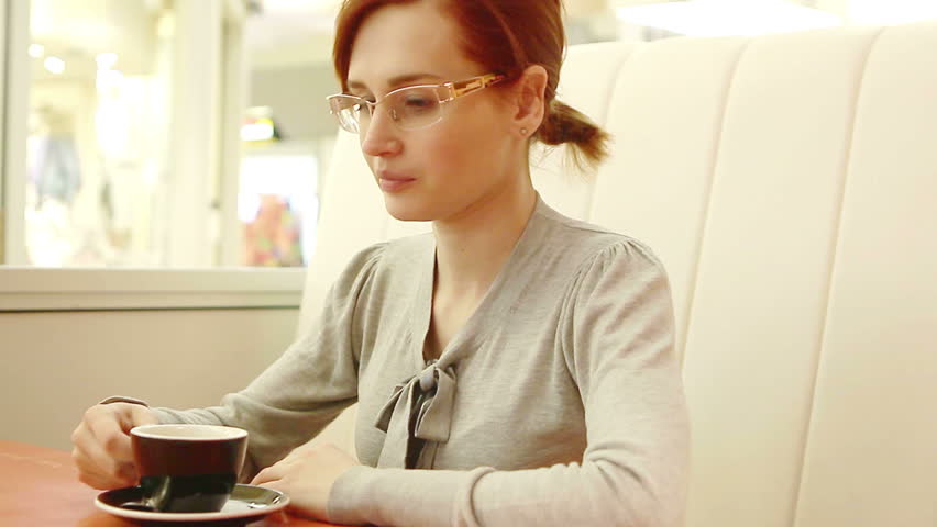 Young woman drink coffee alone