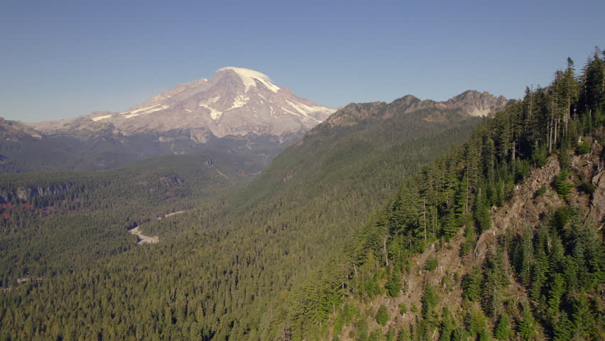 Aerial view of Mount Rainier and surrounding forested mountains, Washington State, USA