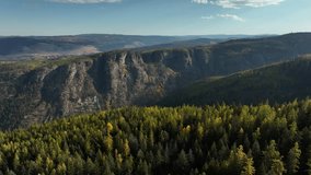A drone scenery of mountain forest in the morning, with blue sky in Myra-Bellevue Park, Kelowna, British Columbia, Canada - Powered by Shutterstock - Get 15% off with code: PIKWIZARD15