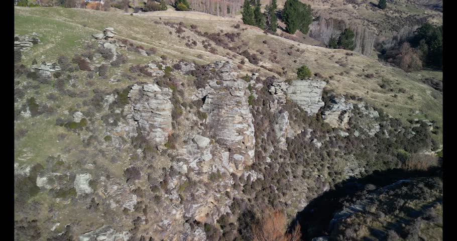 An aerial footage of the scenic rock formations at Flat Top Hill Conservation Area in Butchers Gully, Otago, South Island, New Zealand
