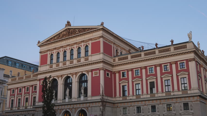 Wiener Musikverein building, a famous concert hall and landmark in Vienna, Austria, opened in 1870. Hyperlapse of the exterior, in the morning light.