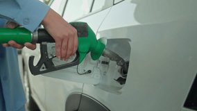 Unrecognizable woman driver vehicle owner girl female hands fuel nozzle in automobile tank filling benzine gasoline at petrol station refueling car gas oil diesel price ecology energy drive transport - Powered by Shutterstock - Get 15% off with code: PIKWIZARD15