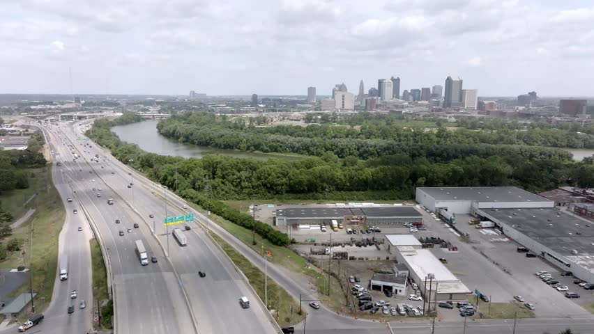 Freeway 71 in Columbus, Ohio with traffic and a wide shot of skyline with stable drone video.