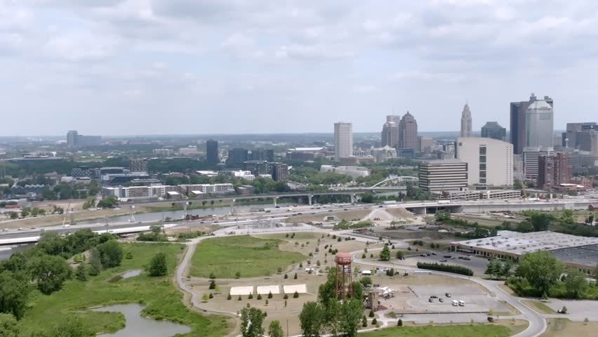 Parallax view of Columbus, Ohio skyline with drone video moving in a circle.