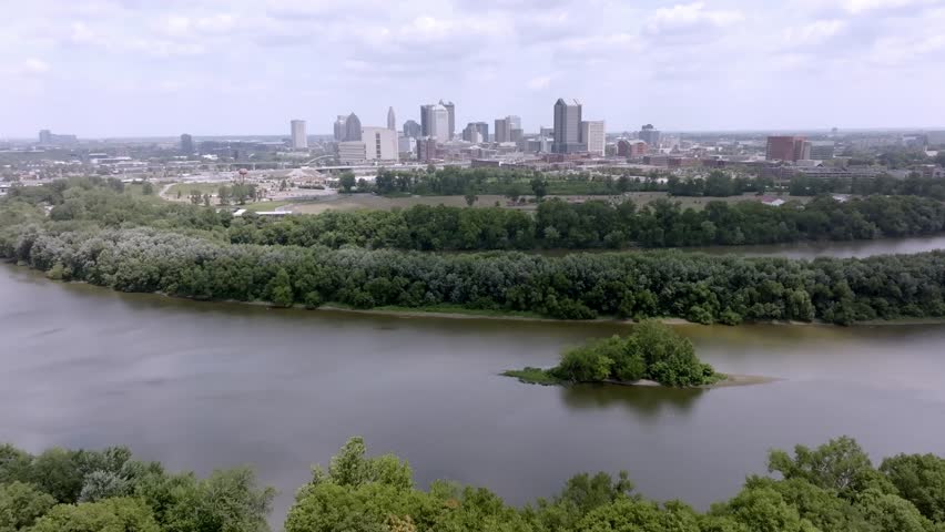 Wide view of Columbus, Ohio skyline with drone video moving forward.