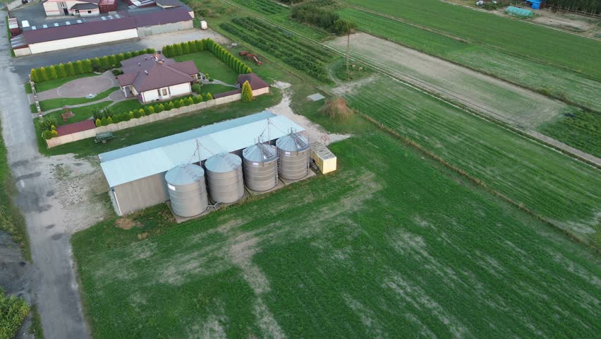 Aerial shot of a farm with metal silos