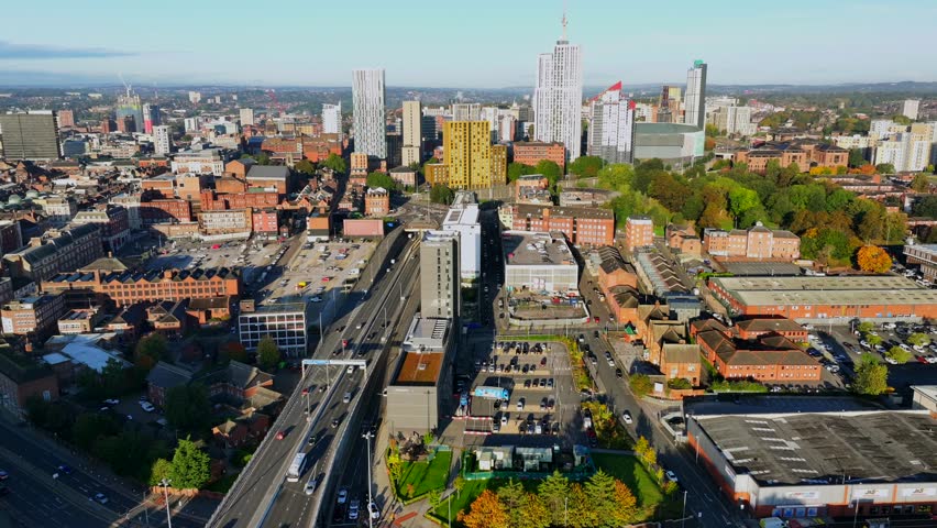 Leeds, West Yorkshire, United Kingdom. October 11, 2024. Aerial video of Leeds skyline in the morning  featuring New York Road and cars driving. 