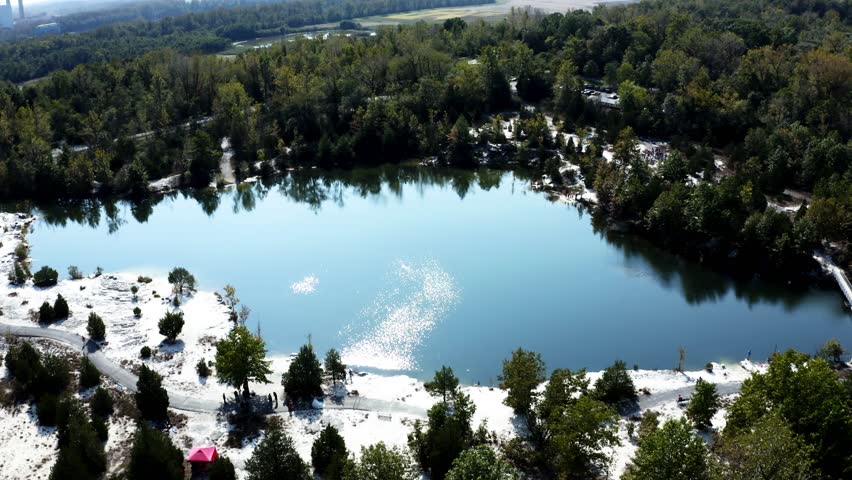 A peaceful view of a lake surrounded by trees at Klondike Park, Missouri, showcasing the natural beauty of the water, lush greenery, and scenic trails, creating a perfect outdoor escape.