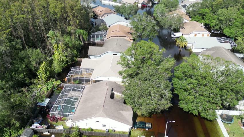 Hurricane Milton devastates New Port Richey, Florida, causing widespread damage. High winds and flooding destroy homes, uproot trees, and leave streets submerged, impacting local communities severely