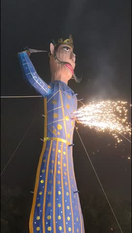 Ravnans being ignited during Dussera festival at ramleela ground in Delhi, India, Big statue of Ravana to get fire during the Fair of Dussera to celebrate the victory of truth by Lord Rama