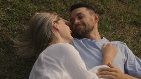Happy Couple Lying on Grass, Enjoying Togetherness - Powered by Shutterstock - Get 15% off with code: PIKWIZARD15