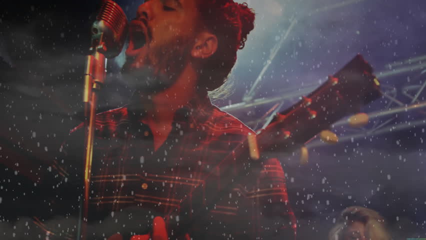 Animation of snow falling over biracial man singing. Entertainment, party and celebration concept digitally generated video.