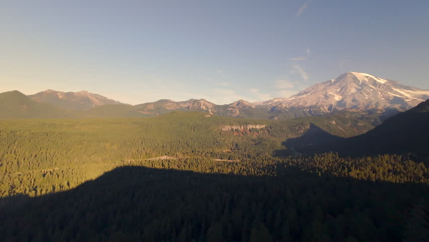 Golden Hour Aerial View of Mount Rainier and Surrounding Forest and Valleys in Washington State