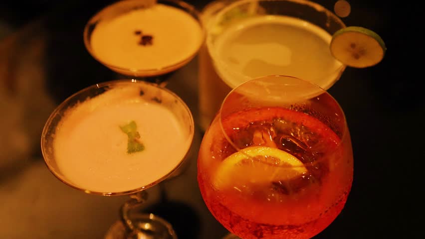 Colorful cocktails on a dimly lit table