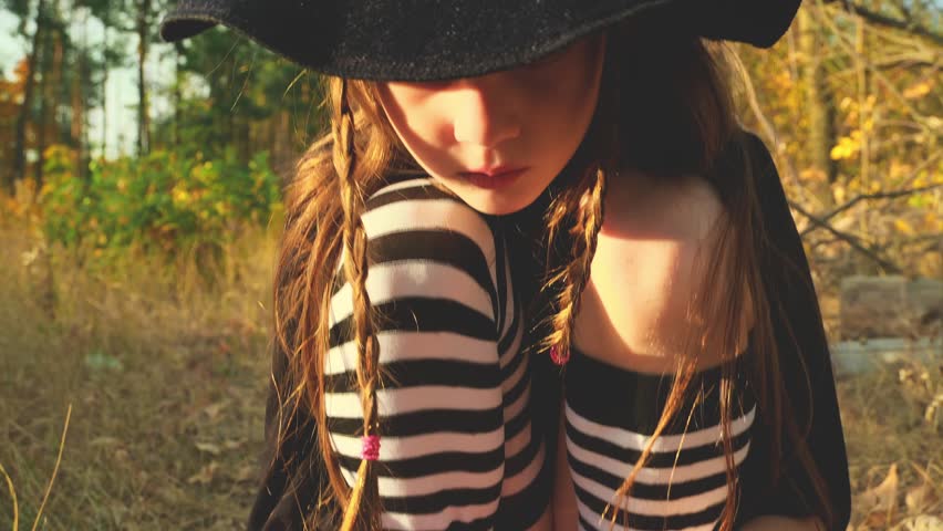 Video portrait of happy girl trick or treating for halloween. Childhood, halloween, tradition and fun concept.