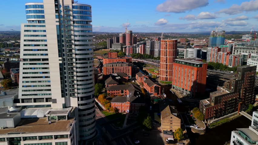 Leeds, West Yorkshire, United Kingdom. October 11, 2024. Aerial video of Leeds skyline in the morning featuring City Atmosphere tower.  