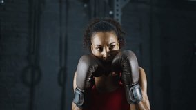 Cinematic video of a fit young woman training in the gym with weights and aerobic exercises. Boxer Woman doing shadow boxing workoutin the fitness club. - Powered by Shutterstock - Get 15% off with code: PIKWIZARD15